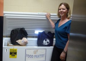New freezer with volunteer at local pantry